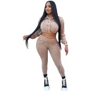 Slim fit washed distressed two-piece fashion set featuring cropped zip jacket and leggings.