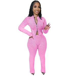 Detailed view of the pink ribbed knit two-piece set featuring a functional two-way zipper.