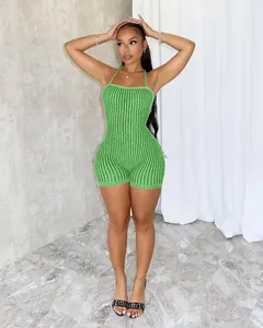 Detail showing the textured ribbed knit and halter neck design of the green romper