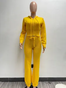 Vibrant yellow two-piece knit set featuring a hooded zip sweater and matching pants