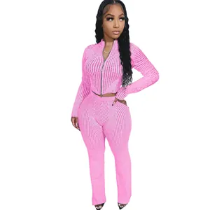 Detailed macro view of the pink ribbed knit texture and two-way zipper on this casual set