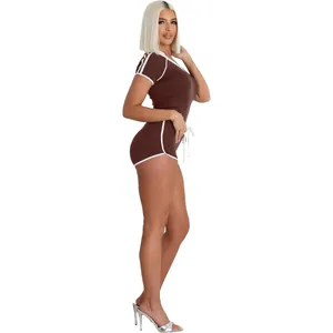 Side view of a brown athletic two-piece set with white piping, V-neckline and high stretch fabric