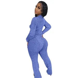 Close-up of women's blue ribbed knit two-piece set featuring long sleeve top and pants