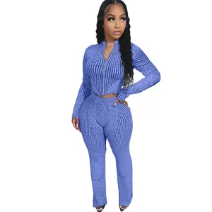 Detailed view of stylish women's blue ribbed knit two-piece set with double-ended zipper