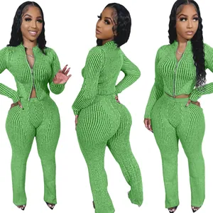 Detail view of women's green ribbed knit two-piece set with two-way zipper