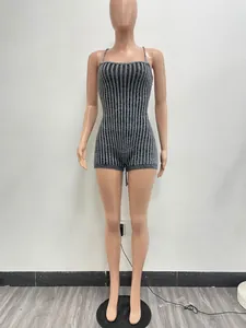 Macro shot of the knitted striped pattern on a sexy backless romper for women.