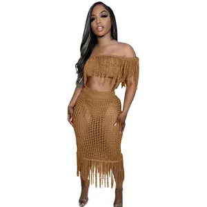 Detailed view of a sexy brown crochet fringe beach set with mesh knit and tassels