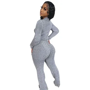 Back view of a women's grey striped knitted two-piece set with flared pants