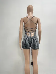 Detail view of grey knitted backless bodysuit featuring sexy lace-up cross straps.