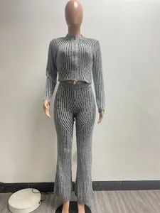 Close-up of a grey ribbed knit two-piece set with a two-way zipper top and flare pants.