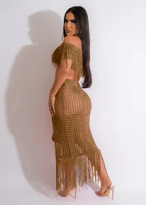 Detail view of khaki crochet two-piece beach set with open knit texture and fringe