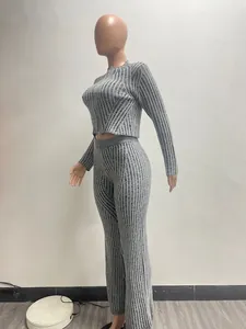 Women's grey striped knit two-piece set featuring two-way zipper top and flared trousers