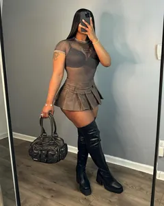 Sexy brown PU leather pleated micro mini skirt shown in a lifestyle mirror selfie outfit