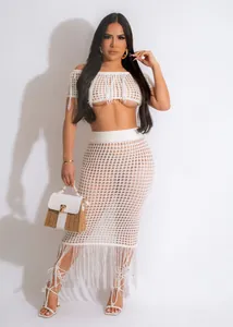 Sexy white crochet two-piece beach set with fringe detail and off-shoulder crop top