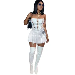 Sexy white sleeveless mini dress featuring lace-up eyelet detail and a pleated skirt design