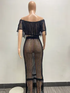 Detailed back view of a sexy black sheer crochet two-piece beach set with long tassels