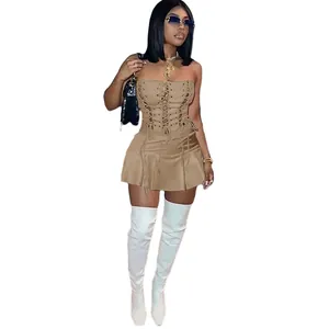 Detail of khaki corset dress with hollow eyelets and lace-up front design