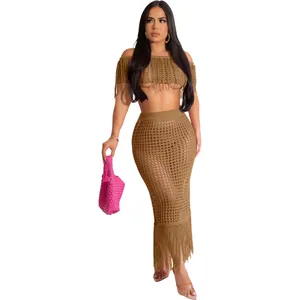 Sexy brown crochet knit two-piece beach set with fringe crop top and tassel maxi skirt