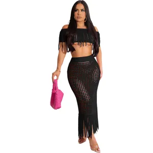 Sexy black knit two-piece beach set featuring fringe crop top and see-through maxi skirt