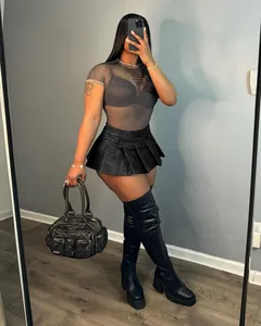 Sexy black faux leather pleated mini skirt in edgy streetwear style