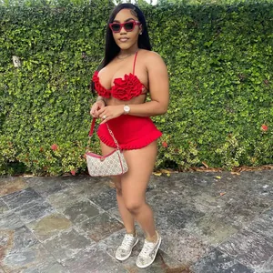 Close-up of a red ruffled halter top and high-waisted shorts set on a model