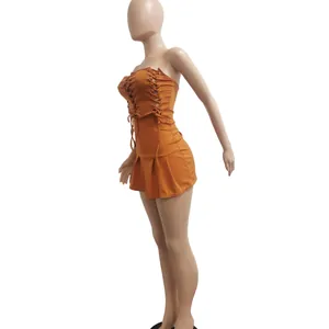Side view of sexy orange sleeveless dress with front lacing and hollow details