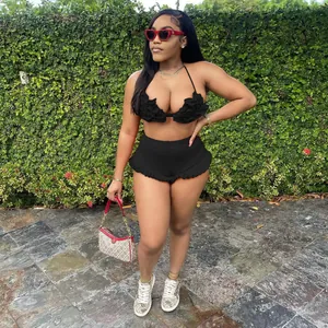 Sexy black halter neck ruffle top and high-waisted shorts two-piece set worn by model