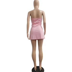 Back view of a sexy pink sleeveless mini dress on a professional mannequin