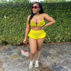Detailed view of a sexy yellow ruffled halter neck backless shorts set for chic women