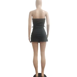 Back view of a chic black strapless mini dress displayed on a full body mannequin