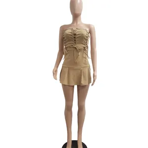 Sexy khaki strapless mini dress featuring front lace-up eyelet details on mannequin