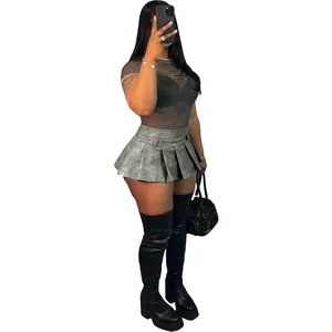Full body shot showing a sexy grey faux leather pleated mini skirt on a fashion model