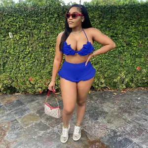 Detailed view of royal blue ruffled halter top and high-waisted shorts two-piece set.