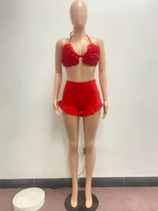 Full front detail showing red 3D floral halter top and matching ruffled hem shorts