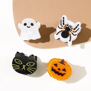 Detailed view of Halloween theme acrylic claw clips with ghost pumpkin and spider designs