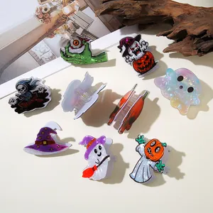 Halloween themed acrylic hair claw clips featuring pumpkin, ghost and wizard motifs.