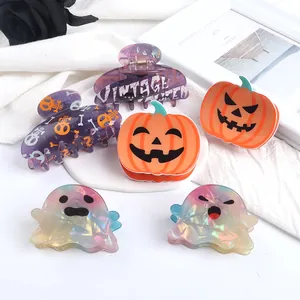 Fun Halloween hair claw clips set featuring quirky pumpkin and iridescent ghost designs