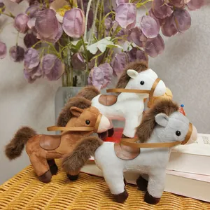 Detailed view of three cute plush horse toys in brown, white and grey colors