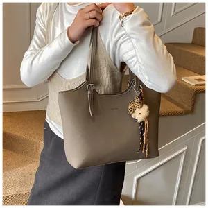 Chic large capacity tote bag with leather texture and cute bear charm for daily commute
