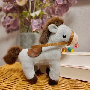 Detailed side view of a cute plush horse keychain with brown mane and saddle