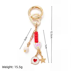 Colgante para bolso colorido con corazón y estrella, largo 12,5 cm y peso 15,5 g