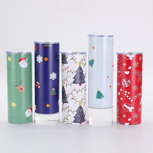 Detailed view of five Christmas-themed skinny tumblers with colorful holiday prints