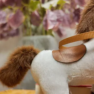 Close-up detail of a brown and white plush horse toy with a soft fuzzy tail.