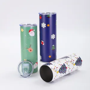 Detail view of 20oz skinny tumblers with festive Christmas patterns and clear lids