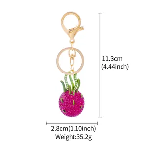 Dimensions for the sparkling pink rhinestone dragon fruit keychain with gold hardware.