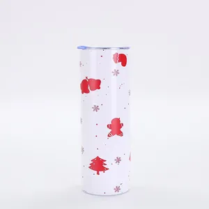 Detailed view of 20oz skinny tumbler with red Christmas gingerbread and tree patterns