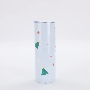 Detailed view of 20oz Christmas tumbler with festive tree and snowflake prints