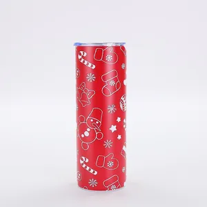 Close-up of 20oz red Christmas slim tumbler with white festive pattern and clear lid
