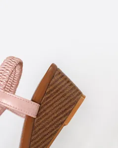 Close-up detail of the 5.0cm comfortable wedge heel on these pink retro platform sandals