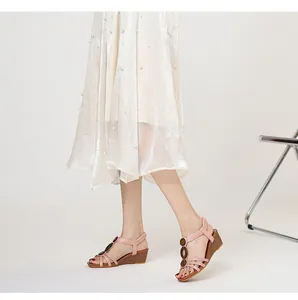 Detail shot of pink wedge sandals with retro wood-grain accents and comfy platform